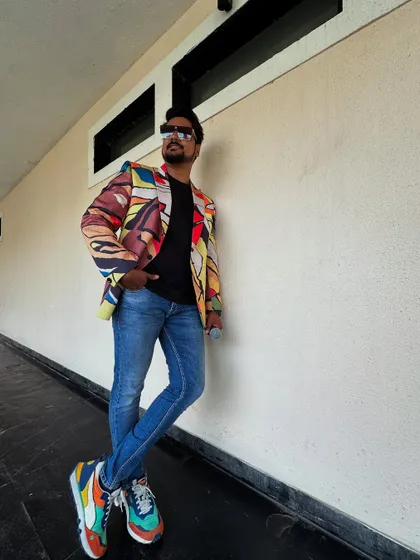 Another angle of my colorful outfit for a poolside event. My style is an extension of the high-energy persona I bring to my hosting.