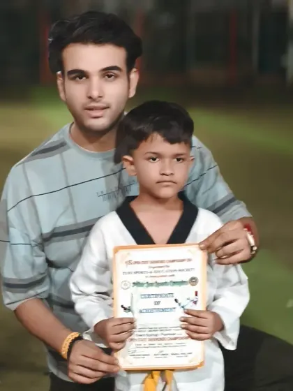 Another proud student with his certificate. I make sure to personally congratulate each student on their accomplishments.