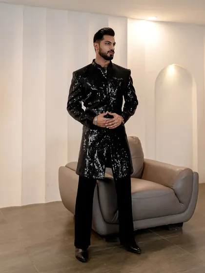The full silhouette of our black sequined Indo-Western jacket. This piece is designed to catch the light and make a bold statement, perfect for a cocktail party or a New Year's Eve celebration.