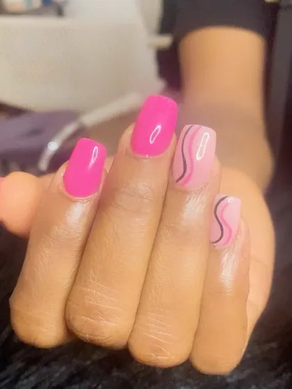 Think pink! A fun manicure with a mix of solid hot pink and abstract swirl art.