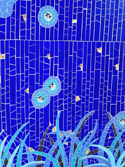A close-up of a stunning blue mosaic by Minima Son-Mosaics, created for our Goa project. The intricate tilework, with hints of gold, captures the feeling of underwater flora and fireflies, adding a layer of bespoke artistry to the space.