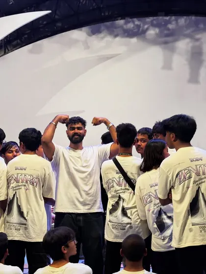 A fun, candid moment with the student crew backstage, showing the collaborative and positive spirit of the event.