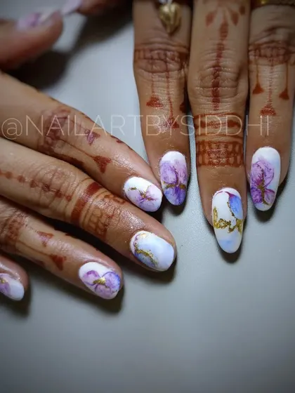 A dreamy, watercolor-style floral design. This set features soft purple and blue flowers on a white base, accented with a touch of gold.