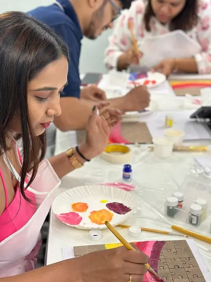 The G2 team let their creativity run wild at a puzzle painting workshop. It's a refreshing break from the usual corporate activities.
