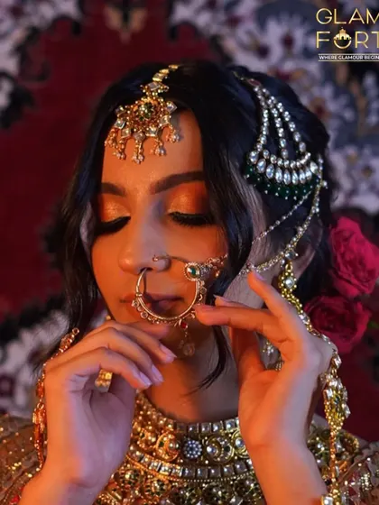Another angle of this regal look, with roses in the hair. The combination of the jewelry, the makeup, and the styling creates a look that is truly cinematic.