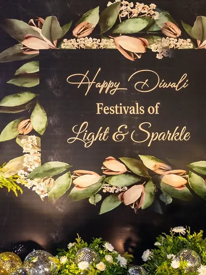 A 'Happy Diwali' photo backdrop with a beautiful floral and leaf design, perfect for capturing festive memories.
