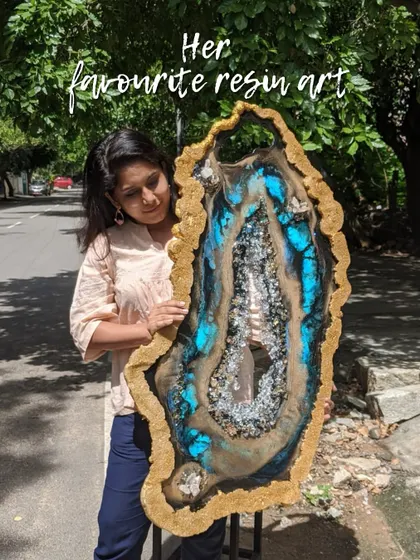 This is one of my favorite geode resin art pieces. The vibrant blue, earthy tones, and sparkling crystals come together to create a powerful statement, perfect for anyone looking to add natural elegance to their decor.