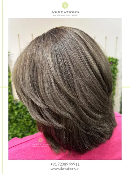 A side view of the ash brown highlights, showcasing the cool tones and the precision of the haircut.