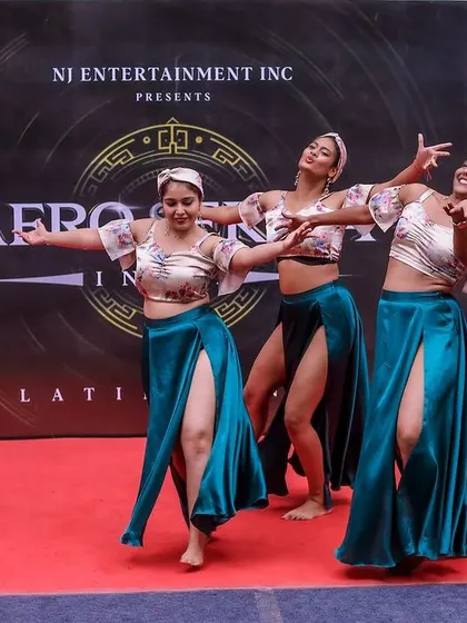 Another angle of our synchronized team pose, showing the unity and polish of our performance group.
