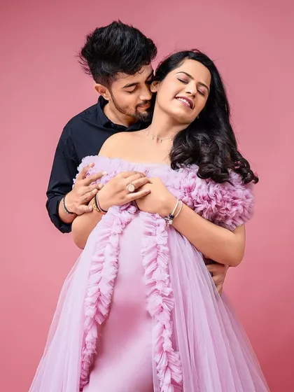 A romantic couple's portrait in our lavender Clara gown. The off-shoulder design and ruffled trail create a soft and dreamy look.