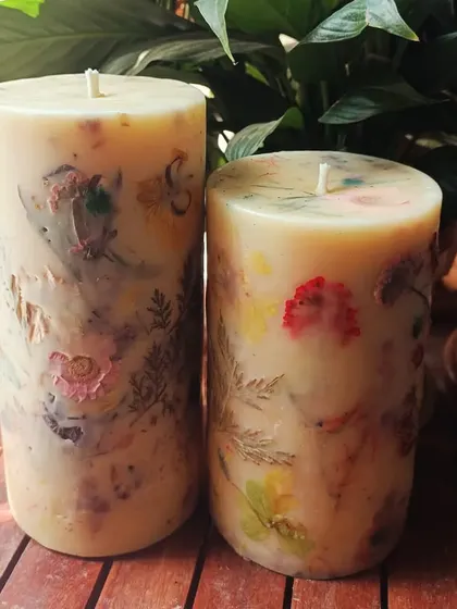 The beauty of handmade. Each of our floral love pillar candles is slightly different, showcasing the natural variation of the real flowers pressed within the wax.