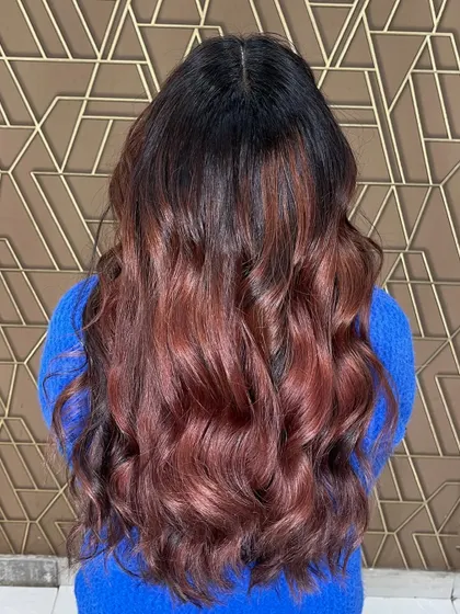 The back view of a global and balayage treatment, showing the seamless blend of colors from root to tip.