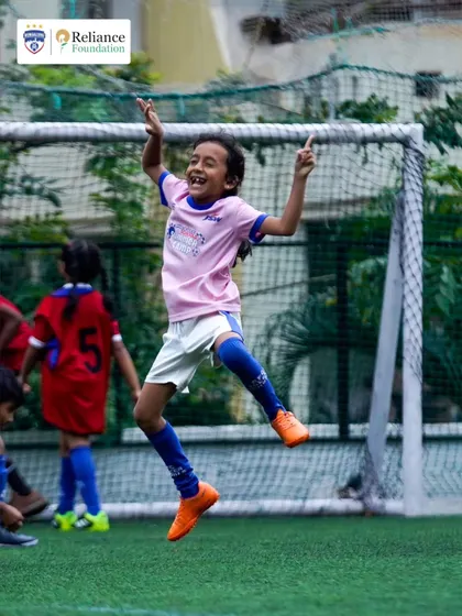 The pure, unfiltered joy of scoring a goal. We believe in creating a fun and positive environment where every child can fall in love with the game and celebrate their achievements.