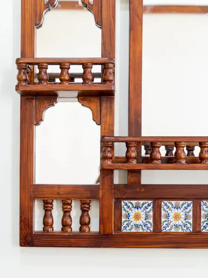 Another detail shot of the jharokha mirror, focusing on the side panel with its multiple mirror sections and intricate woodwork.