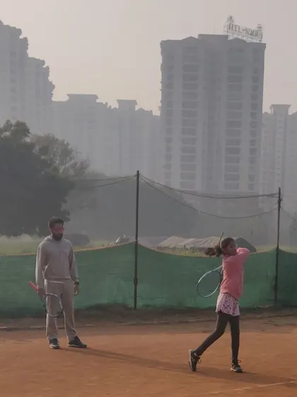 Observing the follow through of a forehand stroke. I provide real time feedback to help players refine their technique and build muscle memory for powerful, accurate shots.
