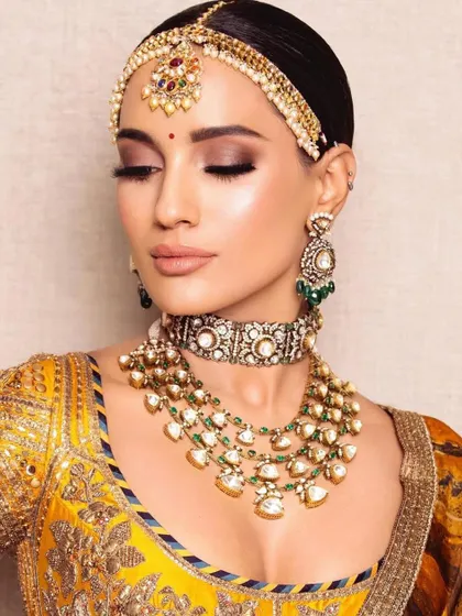 A beautiful Haldi-inspired look. I teach techniques for every wedding function. Join my next batch to learn it all.