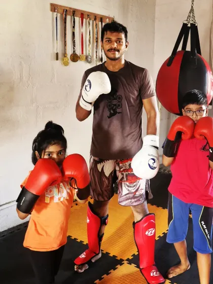 Our kids' summer camp is always a hit. Here are two young warriors geared up and ready to train. We teach them proper stance, punches, and kicks.