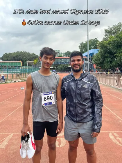 Securing a bronze medal in the competitive Under-18 boys' 400m race at the State Level School Olympics. A proud moment for the athlete and his coach.