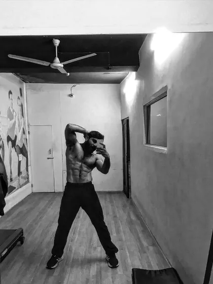 A black and white shot of my physique, highlighting the hard work.