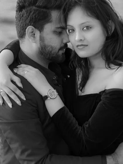 A powerful black and white portrait from a Dubai pre-wedding shoot. Stripping away the color allows the raw emotion and connection to take center stage. Her direct gaze and his closeness create a captivating and intimate image.