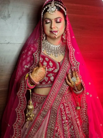 This stunning bride in her red lehenga is a perfect example of a classic North Indian bridal look. We focused on radiant skin, bold eyes, and a traditional bridal bun adorned with flowers.