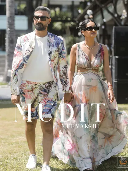 A stylish walking shot of the couple at their Thailand wedding event.