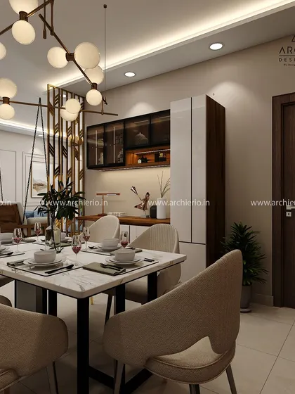 A modern dining setup with a marble-top table and a striking chandelier. The space is designed to feel open and connected to the rest of the home, perfect for family meals.