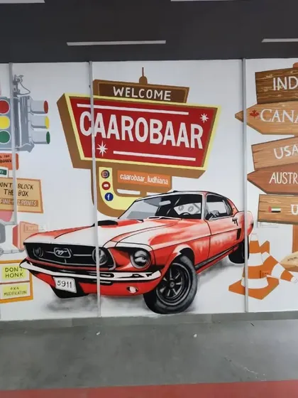A classic American-style mural for CAAROBAR, featuring a vintage red Mustang and a "Welcome" sign. This piece creates a cool, retro vibe for the entrance of the car accessories shop.