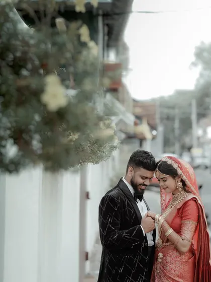 A quiet moment together amidst the wedding day buzz. This intimate portrait of a couple in their wedding attire shows the deep connection that is at the heart of the celebration.