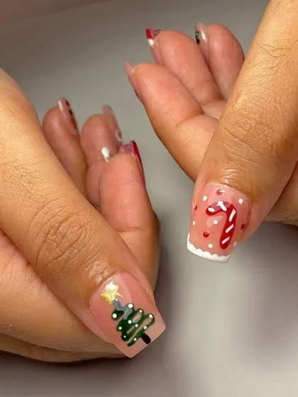 All I want for Christmas is cute nails. A close-up of our hand-painted Christmas tree and candy cane designs.