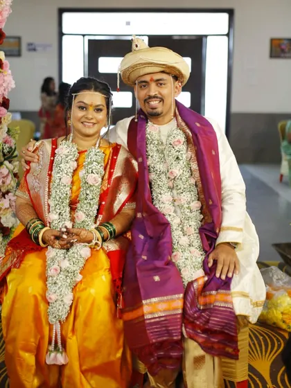 A portrait of the happy couple after the wedding rituals. Both bride and groom look fresh and happy.