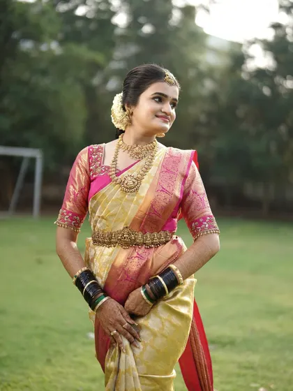 A classic bridal pose. The makeup enhances her features, giving her a timeless and elegant look.
