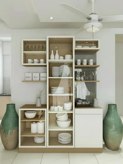 This freestanding crockery unit acts as a beautiful partition between two spaces. The combination of open and closed shelving allows for both display of fine china and storage of everyday items.