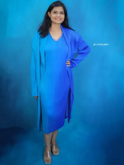 This imported peacock-colored outfit is exclusively available at my studio. It's a versatile two-piece set for parties, corporate events, or shoots.