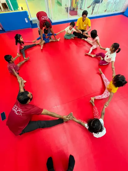 A heart made of friends. This group activity is not just a great stretch; it's a beautiful symbol of the teamwork, trust, and connection our students build in class.