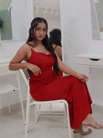 Another shot in the red gown, showing how makeup, outfit, and confidence come together.