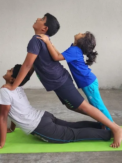 Teamwork makes the dream work. This three-person pose is a testament to what can be achieved when we support each other.