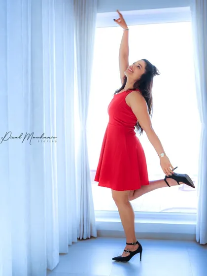 A simple red dress and a bright window. We used the natural light and sheer curtains to create these soft, intimate, and joyful portraits.