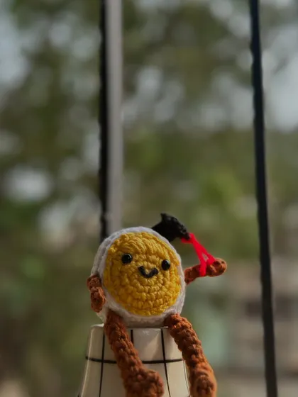 This graduated egg with a slingshot is one of my cheekiest creations. He's sitting proudly, ready to cause a little bit of fun chaos on your desk.