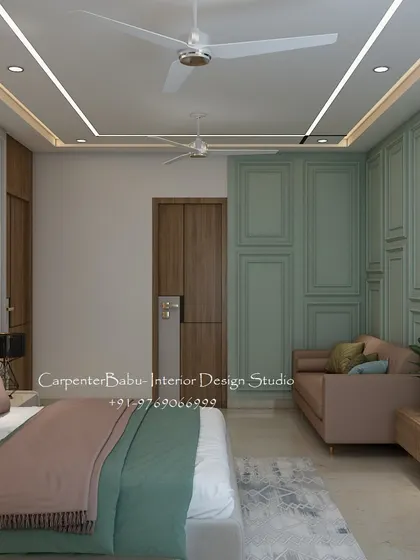 A bridal bedroom designed with a soft and romantic palette of sage green and dusty pink. The wall paneling and cozy loveseat create a space that is perfect for a new beginning.