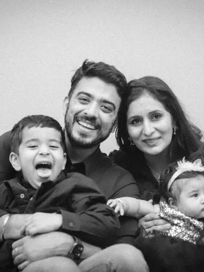 A duplicate of image 30, capturing the family's joyful and playful dynamic.