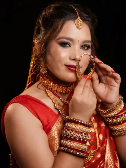 A beautiful Pahadi bridal look, complete with the traditional large nose ring (nath). Our courses celebrate and teach regional bridal traditions.