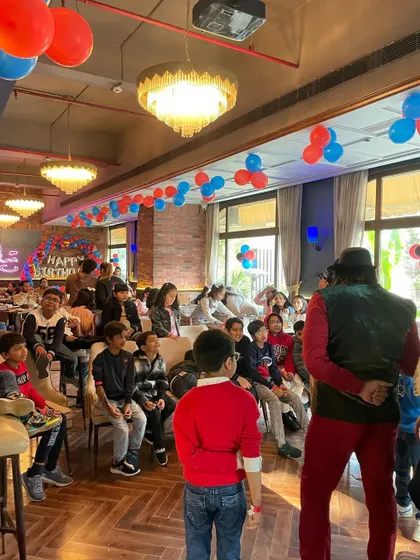 Addressing a full house of kids and parents at a restaurant party. I know how to hold the attention of a large group and make sure everyone is part of the fun.