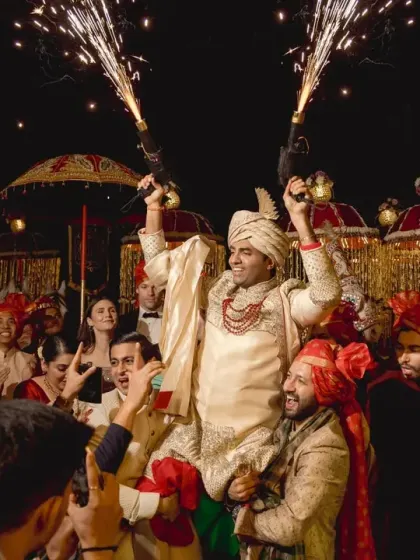 The energy of the baraat is infectious, with the groom celebrating with his friends and family, complete with cold pyro guns for that extra flair.