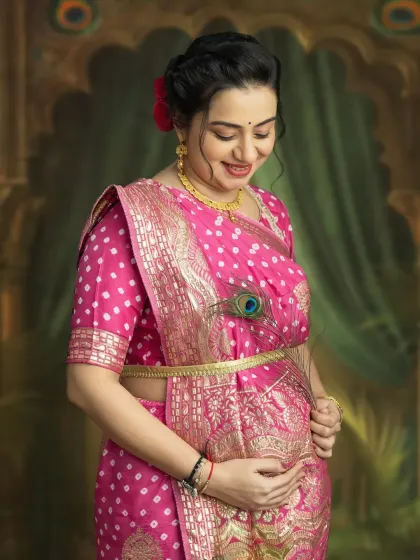 A close-up portrait capturing your gentle smile and the love you hold for your baby. The peacock feather adds a touch of traditional grace to this beautiful maternity photo.