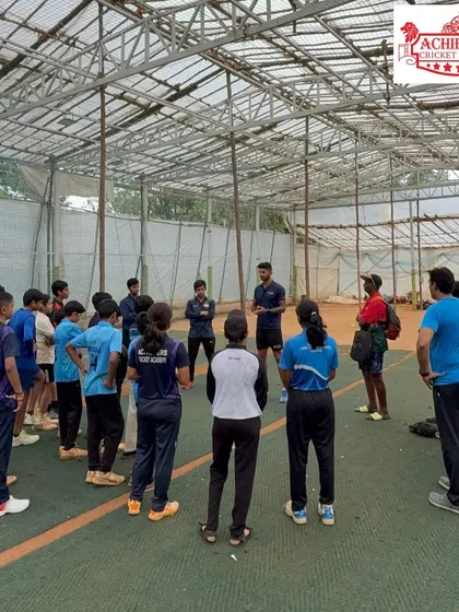 A wide shot of Aman Khan addressing a group of our players. These sessions provide a unique opportunity for our students to learn what it takes to play at the highest level.