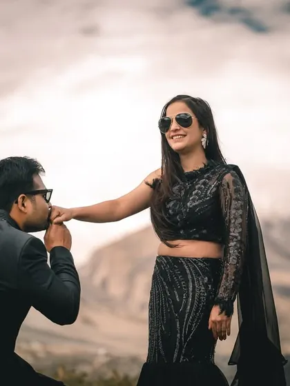A chivalrous moment captured on the roads of Spiti. The dramatic clouds and mountains add a cinematic feel to this pre-wedding portrait.