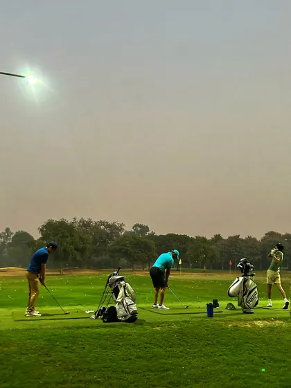 A group of four practices together on the range, a common sight for small groups and friends.