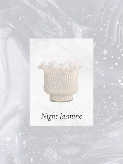 The delicate scent of Night Jasmine, housed in a pearly white Zen Lotus votive, is perfect for quiet summer evenings and moments of peaceful reflection.