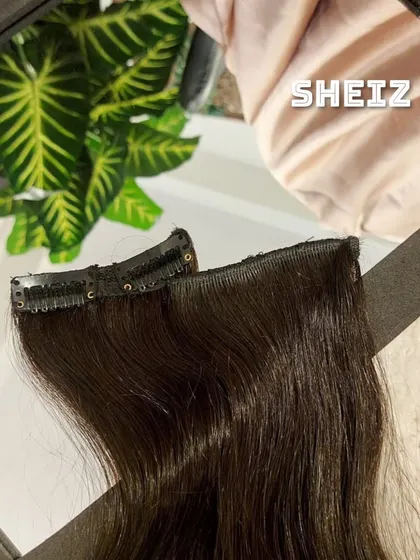 This is a pair of side patch clip-ins, designed to fill in the hair around the face for a fuller look.
